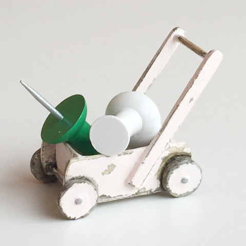 Doll's pushchair with pins by Stafford Allpress